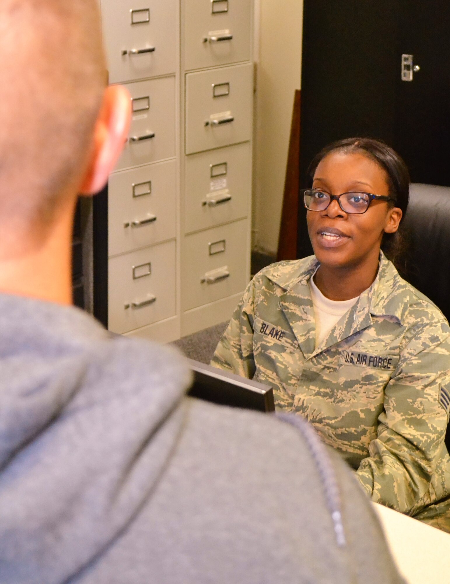 Senior Airman Ameera Blake, a 111th Force Support Squadron customer service specialist, assists a military member with his common access card at Horsham Air Guard Station, Pa, June 8, 2016. Issues dealing with CACs are only one of the many components that encompass the workings of a customer service office in the Air National Guard. (U.S. Air National Guard photo by Tech. Sgt. Andria Allmond)
