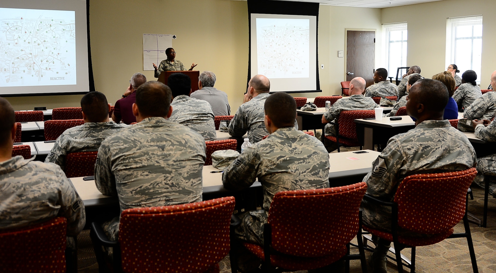 Tech. Sgt. Quanna Charles, a Green Dot representative assigned to the 6th Air Mobility Wing, conducts a one-hour Green Dot Training session on MacDill Air Force Base, Fla., June 8, 2016. The Green Dot program focuses on providing tools and training through activities, open dialogue and a peer-to-peer learning style to create realistic options for preventing violent events. (U.S. Air Force photo by Senior Airman Tori Schultz)