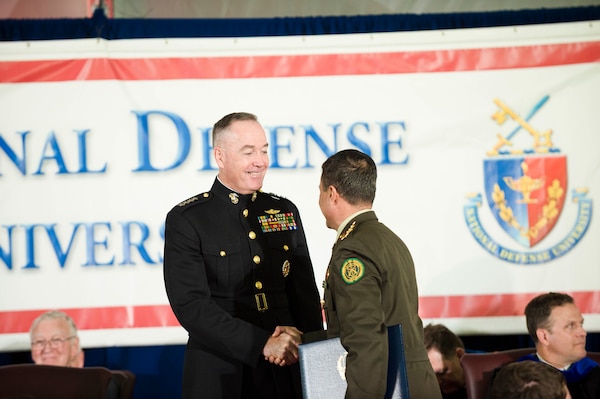 Marine Corps Gen. Joe Dunford, chairman of the Joint Chiefs of Staff, congratulates graduates during the National Defense University's 2016 graduation ceremony at Fort Lesley J. McNair in Washington, D.C., June 9, 2016. DoD photo by Army Staff Sgt. Sean K. Harp