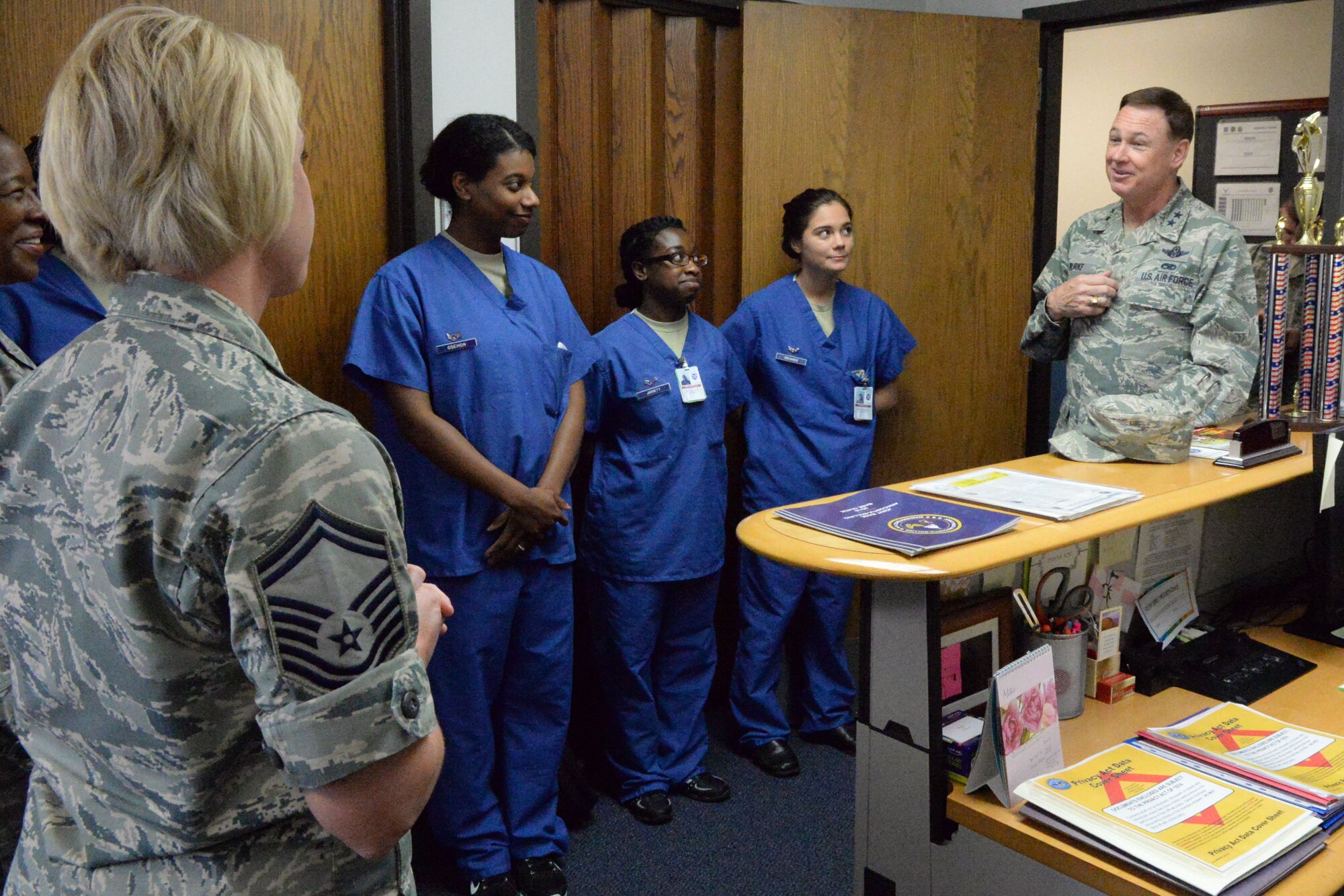 Air Force District of Washington Commander Maj. Gen. Darryl Burke meets members of the 579th Medical Group on Joint Base Anacostia-Bolling, Washington D.C., June 9, 2016.  Gen. Burke visited the Airmen of the dental clinic to present a coin to Senior Master Sgt. Jennifer Klink for her efforts in making 2015 AFDW Annual Awards banquet a memorable event.