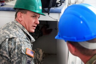 Army Sgt. 1st Class Brian Hafenstein, left, and Army Staff Sgt. Matt Garland look at the plumbing connections under a sink in a classroom in a new school for Guatemalan children during Beyond the Horizon 2016 in Tocache, Guatemala, June 02, 2016. Hafenstein is assigned to the 378th Engineer Detachment and Garland is assigned to the 1021st Engineer Company. Army photo by Spc. Tamara Cummings