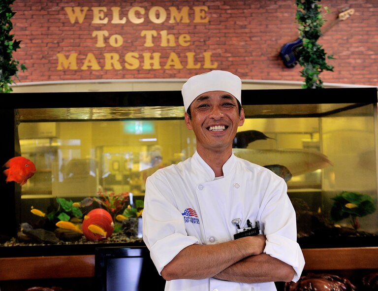 Takashi Seragaki, 18th Force Support Squadron cook, works at the Marshall Dining Facility, June 3, 2016, at Kadena Air Base, Japan. As a cook, Seragaki has been working at the DFAC for more than 23 years to serve Airmen and help them stay mission ready. (U.S. Air Force photo by Naoto Anazawa) 