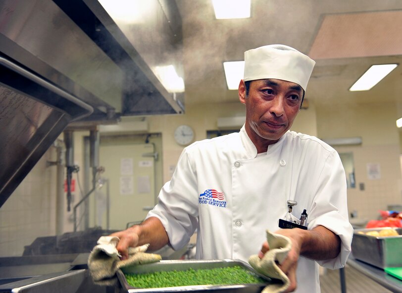 Takashi Seragaki, 18th Force Support Squadron cook, prepares lunch at the Marshall Dining Facility, June 3, 2016, at Kadena Air Base, Japan. Seragaki said he became a cook because most of the people he knew were also cooks. (U.S. Air Force photo by Naoto Anazawa)
