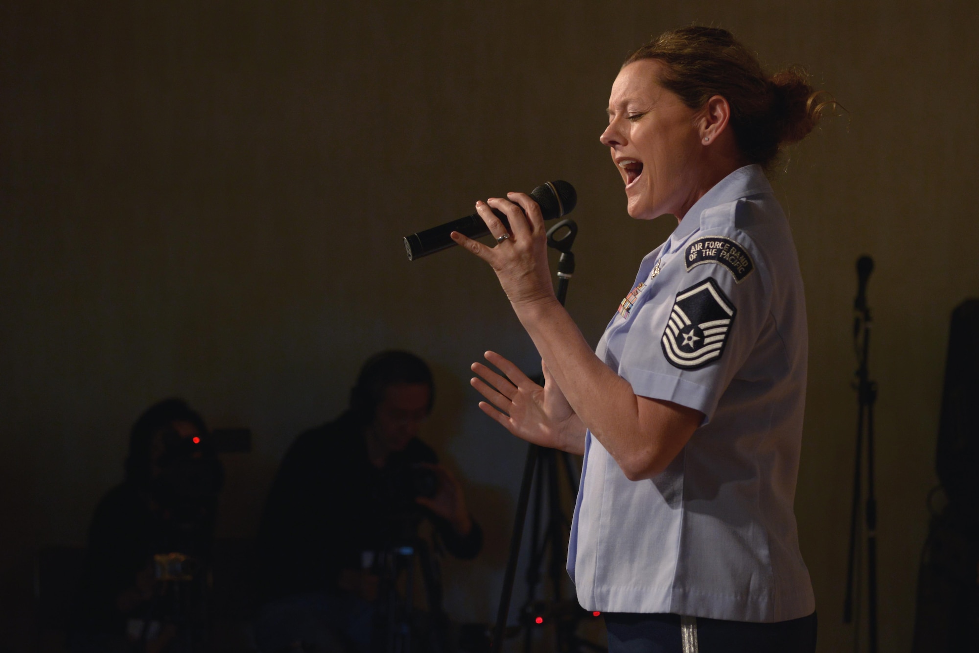 Master Sgt. Julie Bradley, vocalist with the Band of the Pacific-Asia, sings for a crowd during the Tokyo Inaka Festival at Gyokusen Ji Temple, Akiruno City, Tokyo, Japan, June 5, 2016. The band was formed during World War II; more than 70 years later, they perform for Japanese communities in support of the U.S.-Japan alliance. (U.S. Air Force photo by Staff Sgt. Cody H. Ramirez/Released)