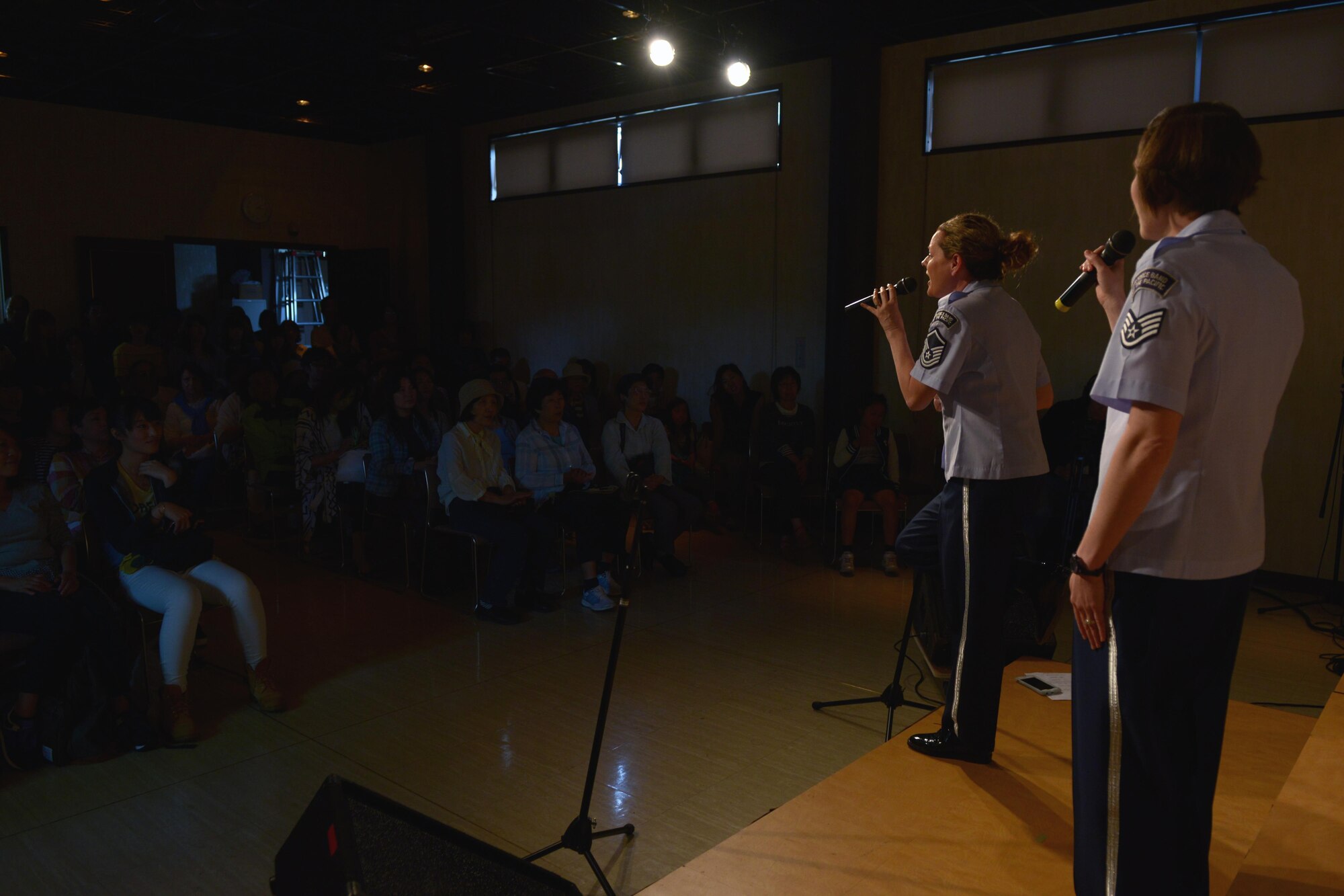 Master Sgt. Julie Bradley and Staff Sgt. Joanne Griffin, vocalists with the Band of the Pacific-Asia, sing for a crowd during the Tokyo Inaka Festival at Gyokusen Ji Temple, Akiruno City, Tokyo, Japan, June 5, 2016. The Band of the Pacific-Asia performs approximately 200 times each year throughout the Indo-Asia Pacific Region. (U.S. Air Force photo by Staff Sgt. Cody H. Ramirez/Released)