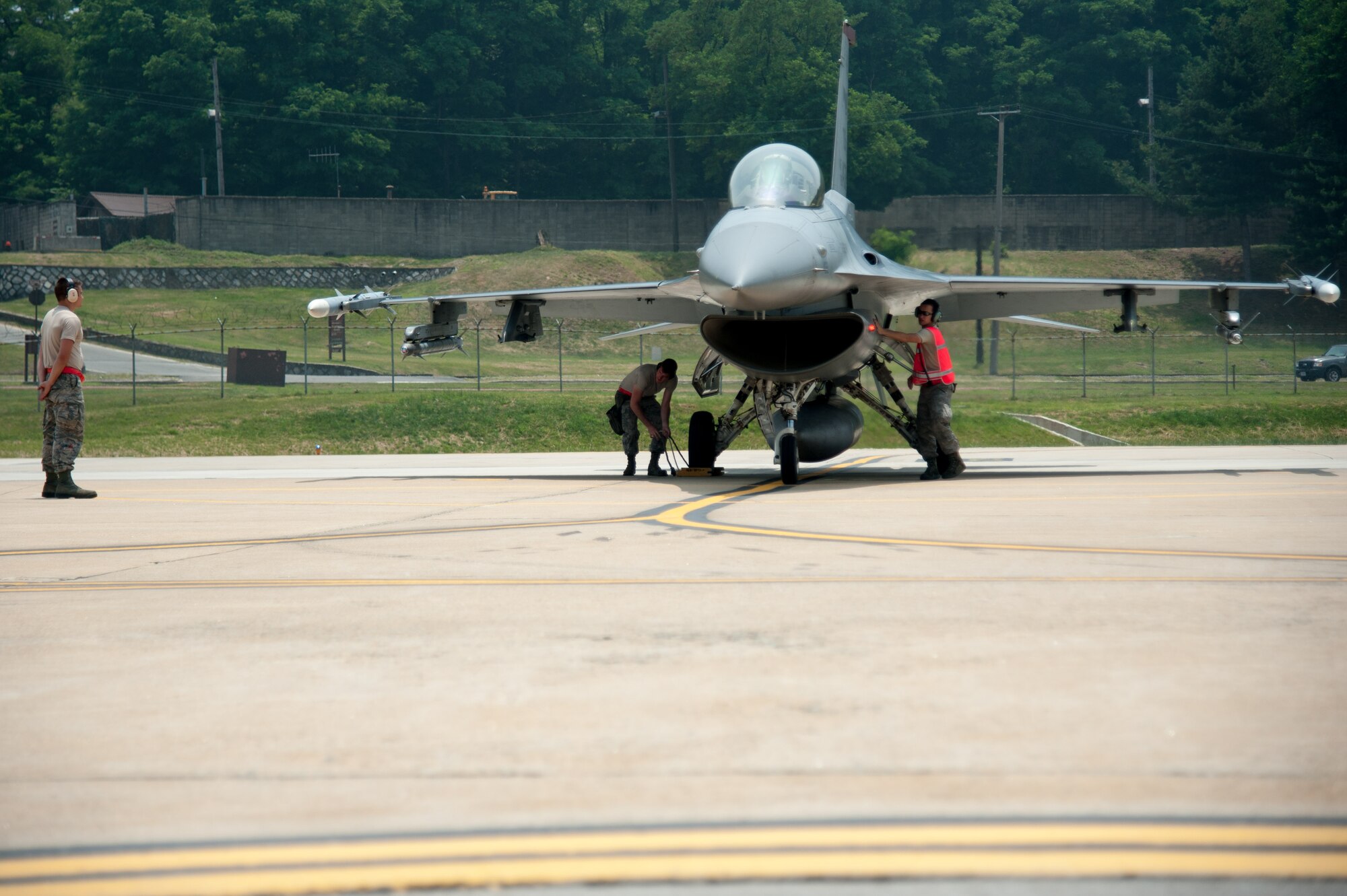 Airmen assigned to the 36th Aircraft Maintenance Unit arm an F-16 Fighting Falcon assigned to 36th Fighter Squadron in preparation for Buddy Wing 16-5 at Osan Air Base, Republic of Korea, June 9, 2016. The purpose of the Buddy Wing Program is to execute joint tactics, exchange ideas and improve interoperability between the U.S. Air Force and ROKAF pilots, maintainers and support personnel. (U.S. Air Force photo by Staff Sgt. Jonathan Steffen/Released)
