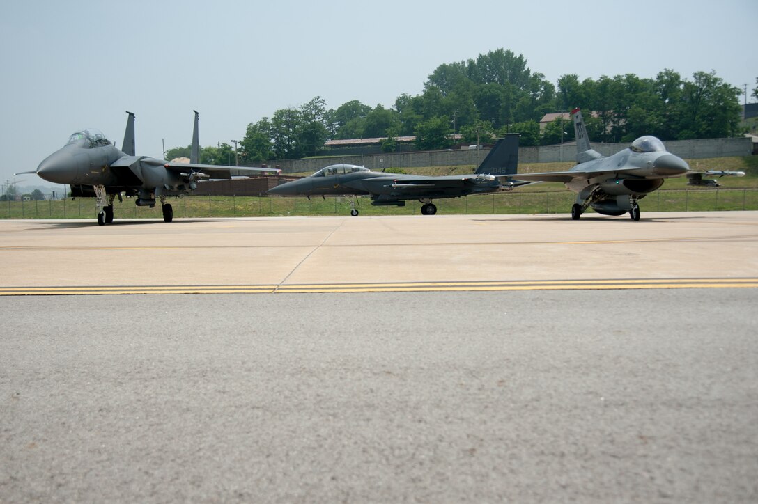 Republic of Korea air force F-15K Slam Eagles from the 11th Fighter Wing and a U.S. Air Force F-16 Fighting Falcon from the 36th Fighter Squadron wait to take off from Osan Air Base, Republic of Korea, June 9, 2016. The F-16s integrated with F-15s to train basic fighter and air combat maneuvers during Buddy Wing 16-5. (U.S. Air Force photo by Staff Sgt. Jonathan Steffen/Released)