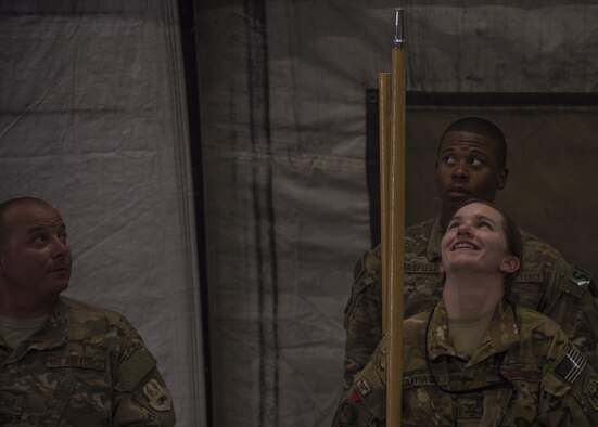 Technical Sgt. Brian Esser, Senior Airman Katrina Santiago (front), and Airman 1st Class Tony Brasfield (back), 455th Air Expeditionary Wing Honor Guard, practice for upcoming ceremonies at Bagram Airfield, Afghanistan, June 08, 2016. Base Honor Guard members help instruct and perform ceremonial duties to include: change of commands, ceremonies, and posting of the colors. (U.S. Air Force photo by Senior Airman Justyn M. Freeman)