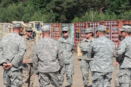 SFC Bryce Williams  of the 16th SSB HHC gives a safety briefing to members of the 592nd Ordnance Co. located at the Drawsko Pomorskie Training Area prior to days operations.