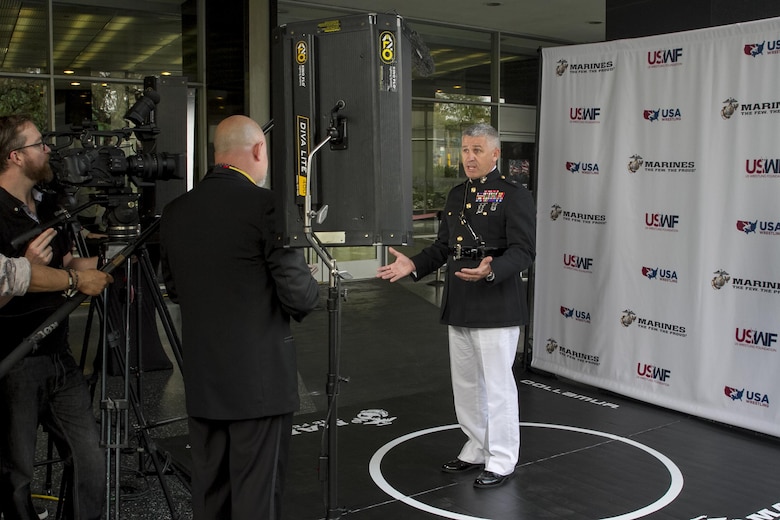 Brigadier Gen. Paul Kennedy answers a question from a U.S. Wrestling Foundation representative at the U.S. Wrestling Foundation Gala in Los Angeles, June 9, 2016. The Marine Corps joined a host of VIPs in in sending off Team USA as they compete in the World Cup, their last competition before the Olympic Games in Rio de Janeiro and awarded two young future leaders at the gala. Marine recruiters view combat sports (professional and amateur wrestling and mixed martial arts) as excellent programming venues to reach a large portion of the Marine Corps’ enlisted and officer recruiting prospects. Principles taught to student wrestlers such as discipline, physical fitness, aggressive attitude and mental and physical toughness align with Marine Corps principles.