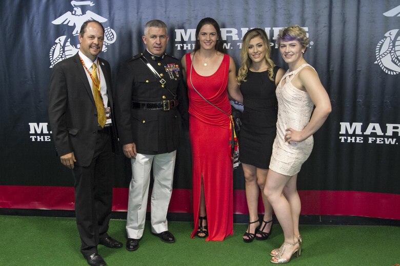Brigadier Gen. Paul Kennedy poses for a photo with (right to left) Elena Pirozhkova, Helen Maroulis, and Adeline Gray. Pirozhkova is a two-time Olympian and world champion wrestler. Maroulis is a world champion wrestler and is ranked number one heading into the olympics. Gray is a three-time world champion wrestler and is ranked number one heading into the Olympics.