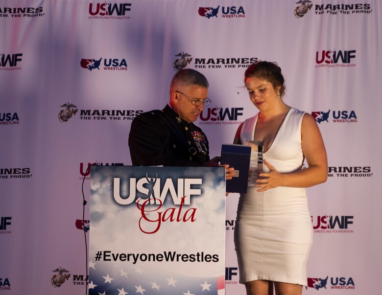 Brigadier Gen. Paul Kennedy presents Kendall Reusing the Excellence in Leadership Award during the U.S. Wrestling Foundation Gala in Los Angeles, June 9, 2016. The Marine Corps advocates for high-achieving student athletes and views this engagement as an opportunity to establish a strong connection with America’s youth. Reusing, a Riverside, Calif., native and freshman at Simon Fraser University, was the 2015 California Wrestling State Champion, 2015 United World Wrestling Junior Runner-Up, and was also the 2015 La Sierra High School Valedictorian. Kennedy currently serves as the commanding general of Marine Corps Recruiting Command.