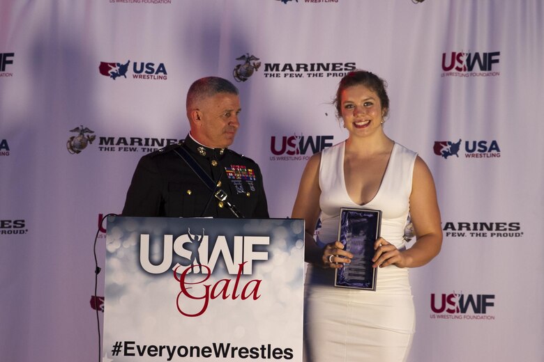 Brigadier Gen. Paul Kennedy presents Kendall Reusing the Excellence in Leadership Award during the U.S. Wrestling Foundation Gala in Los Angeles, June 9, 2016. The Marine Corps advocates for high-achieving student athletes and views this engagement as an opportunity to establish a strong connection with America’s youth. Reusing, a Riverside, Calif., native and freshman at Simon Fraser University, was the 2015 California Wrestling State Champion, 2015 United World Wrestling Junior Runner-Up, and was also the 2015 La Sierra High School Valedictorian. Kennedy currently serves as the commanding general of Marine Corps Recruiting Command.