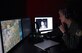 Maj. Jennifer Giovannetti, 359th Aerospace Medicine Squadron Aerospace and Physiology Flight commander, instructs a T-6 pilot instructor through a spatial disorientation trainer profile designed to induce the vestibulo-ocular reflex called nystagmus at Joint Base San Antonio – Randolph, June 7. The GYRO Integrated Physiological Trainer II exposes pilots to the typical vestibular (inner ear) and visual illusions they experience during flight. (U.S. Air Force photo/Staff Sgt. Jason Huddleston/Released)