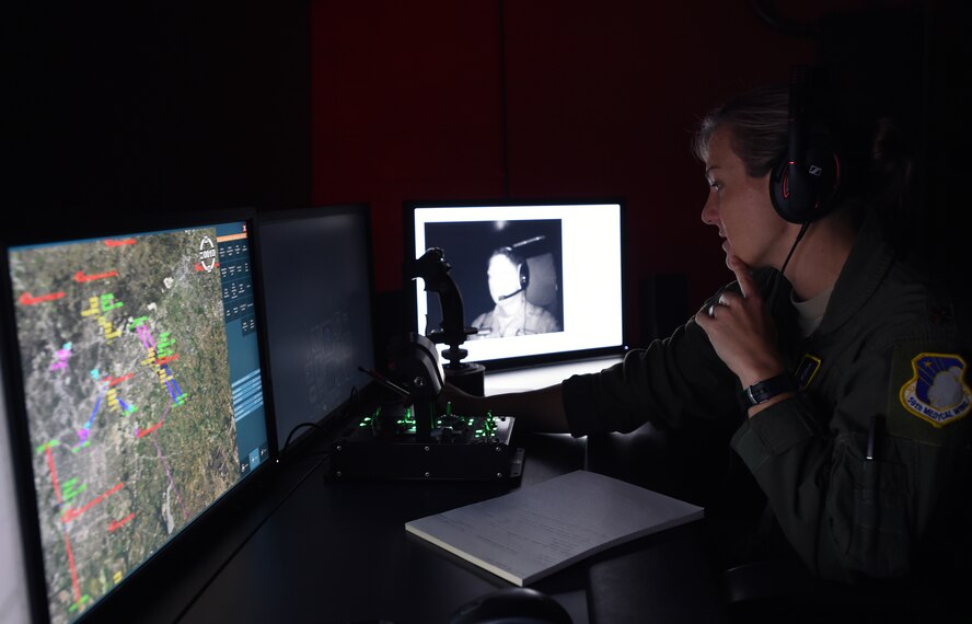 Maj. Jennifer Giovannetti, 359th Aerospace Medicine Squadron Aerospace and Physiology Flight commander, instructs a T-6 pilot instructor through a spatial disorientation trainer profile designed to induce the vestibulo-ocular reflex called nystagmus at Joint Base San Antonio – Randolph, June 7. The GYRO Integrated Physiological Trainer II exposes pilots to the typical vestibular (inner ear) and visual illusions they experience during flight. (U.S. Air Force photo/Staff Sgt. Jason Huddleston/Released)