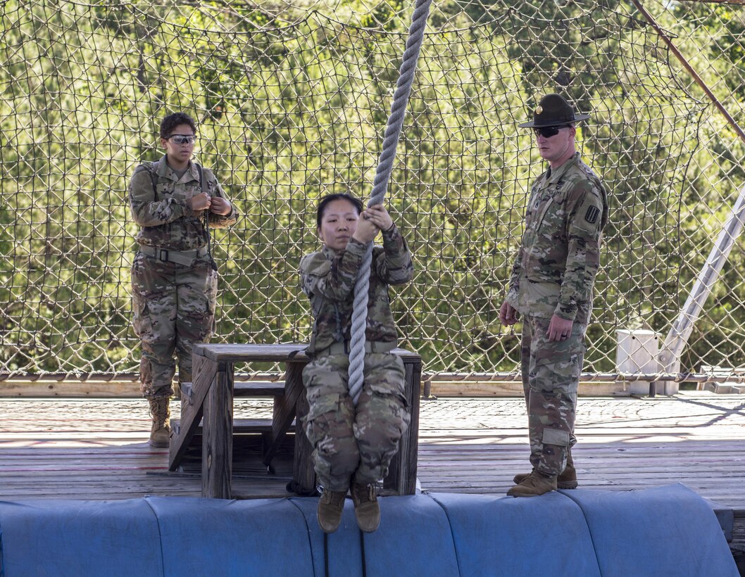 Staff Sgt. Trevin Sparks, a drill sergeant with A Company, 2nd Battalion, 13th Infantry Regiment at Fort Jackson, S.C. watches as Soldiers in their first full week of Basic Combat Training cross a pit on top of the 40-foot high Victory Tower, June 8.(U.S. Army photo by Sgt. 1st Class Brian Hamilton/ released)