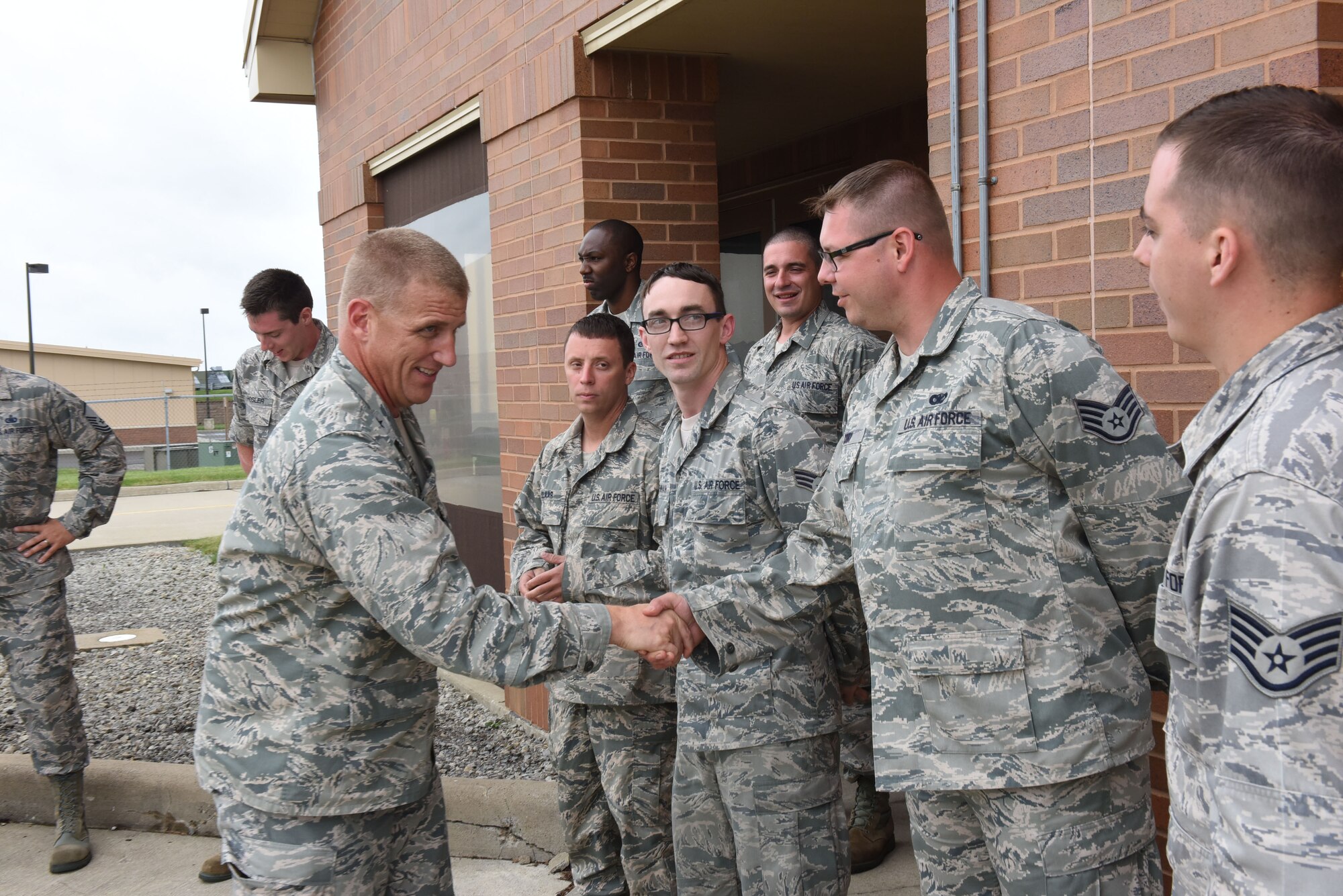 Brig. Gen. Hickok, deputy director of logistics, engineering and force protection at Headquarters Air Force Reserve Command, shakes the hand of a member of the 911th Logistic Readiness Squadron Fuels Flight at the Pittsburgh International Airport Air Reserve Station, June 5, 2016. Hickock came to the Pittsburgh IAP ARS to present the flight with the Golden Derrick Award in recognition of their excellent performance. (U.S. Air Force photo by Airman Beth Kobily)