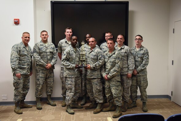 The 911th Logistic Readiness Squadron Fuels Flight pose for a photo with Brig. Gen. John A. Hickok, deputy director of logistics, engineering and force protection at Headquarters Air Force Reserve Command, at the Pittsburgh International Airport Air Reserve Station, June 5, 2016. The general presented the flight with the Golden Derrick Award, an annual award that recognizes one outstanding fuels flight in the AFRC. (U.S. Air Force photo by Airman Beth Kobily)