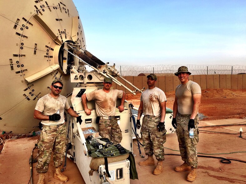 Airmen from the 1st Combat Communications Squadron take a break as they remove seven pallets of equipment in Africa. The 1st CBCS and the 435th Air Ground Operations Wing build and enhance bases and networks. This was the first time an entire combat communications team and equipment was switched out. (Courtesy Photo)