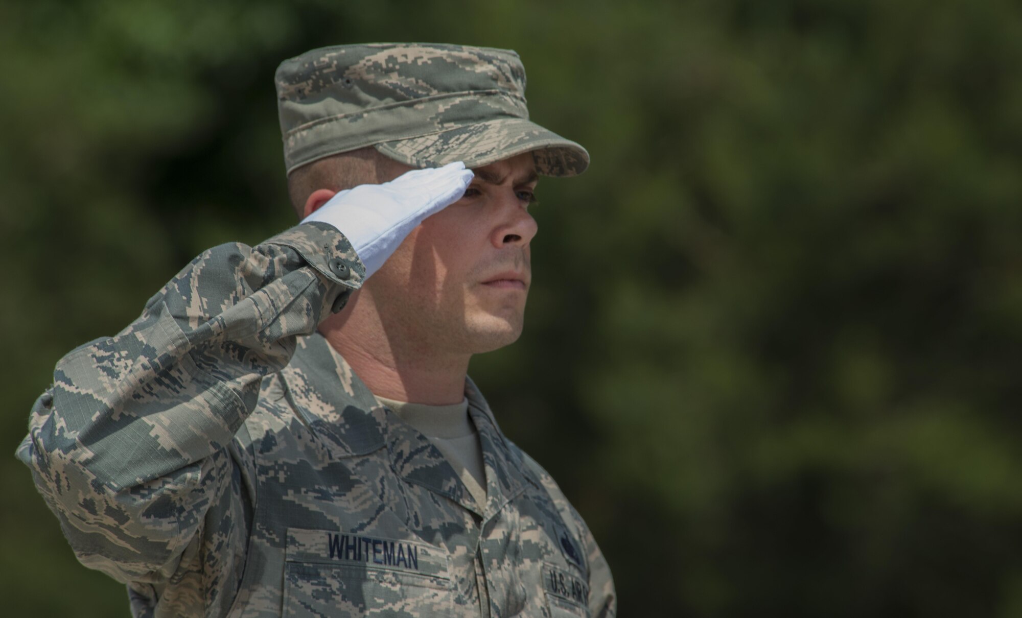 Tech. Sgt. Daniel Whiteman, 786th Force Support Squadron NCO in charge of base honor guard, salutes during a funeral ceremony demonstration as a part of the Air Education and Training Command’s Class 5 Basic Protocol, Honors and Ceremonies Course graduation June 9, 2016, at Ramstein Air Base, Germany. Members of the Air Force Honor Guard Mobile Training Team taught the course for Honor Guard Airmen across U.S. Air Forces in Europe. The graduates completed 80 hours of training in pallbearing, firing party, colors and maintenance and wear of the ceremonial uniform. (U.S. Air Force photo/Airman 1st Class Tryphena Mayhugh)