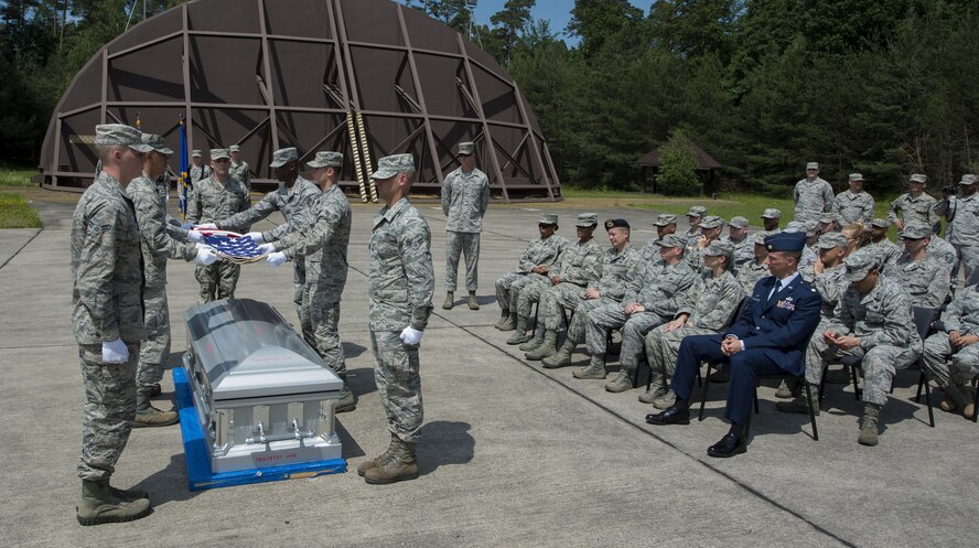 Graduates from the Air Education and Training Command’s Class 5 Basic Protocol, Honors and Ceremonies Course participate in a funeral ceremony demonstration during the graduation ceremony June 9, 2016, at Ramstein Air Base, Germany. The course was established to provide training and procedural guidance for rendering proper military funeral honors. It emphasizes the importance of military customs and courtesies, dress and appearance and drill and ceremony. (U.S. Air Force photo/Airman 1st Class Tryphena Mayhugh)