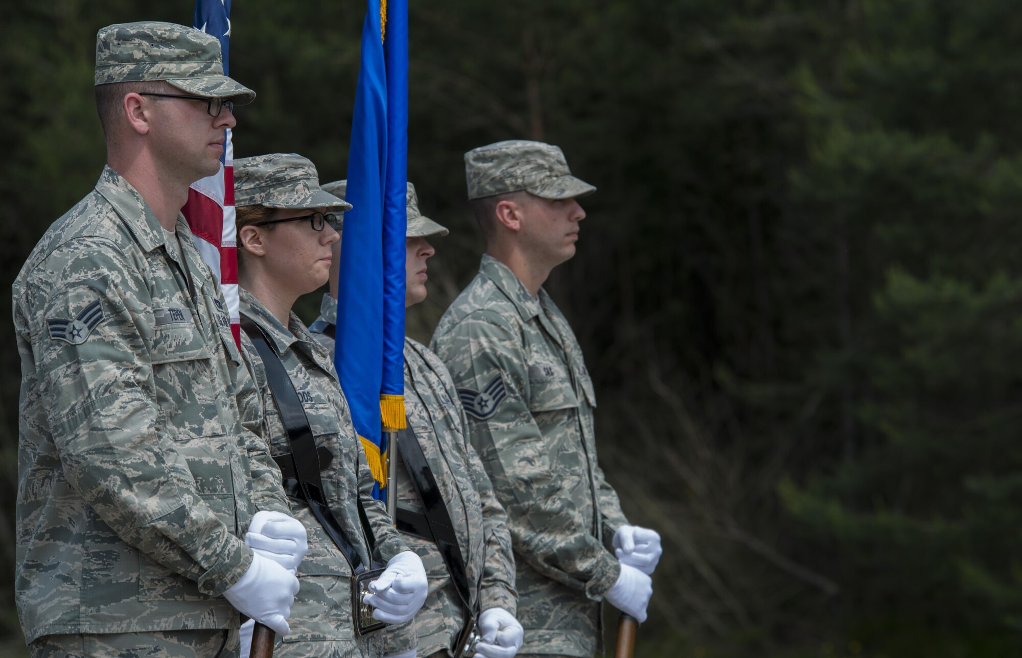 Graduates from the Air Education and Training Command’s Class 5 Basic Protocol, Honors and Ceremonies Course post the colors in a demonstration of a funeral ceremony during their graduation ceremony June 9, 2016, at Ramstein Air Base, Germany. Members of the Air Force Honor Guard Mobile Training Team taught the course for Honor Guard Airmen across U.S. Air Forces in Europe. The graduating class consisted of Airmen from Aviano Air Base, Italy; Royal Air Force Station Mildenhall, United Kingdom; Incirlick Air Base, Turkey and Ramstein. (U.S. Air Force photo/Airman 1st Class Tryphena Mayhugh)