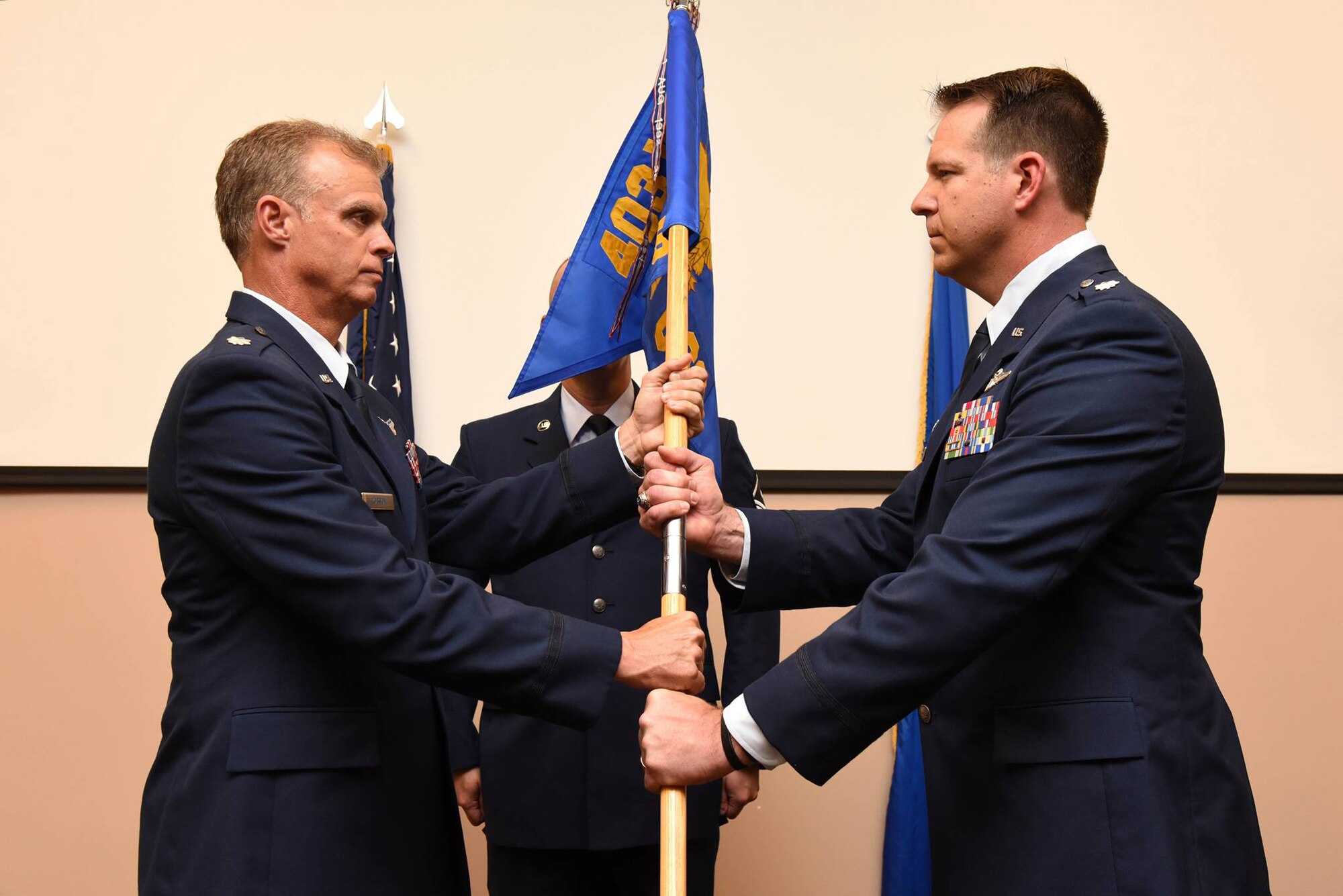 Lt. Col. Andrew Walter (right) took command of the 403rd Operations Support Squadron during a change of command ceremony held June 4, 2016, at Keesler Air Force Base, Mississippi. Lt. Col. Keith Gibson (left), 403rd Operations Group commander, presided over the ceremony. (U.S. Air Force photo/Tech. Sgt. Ryan Labadens)