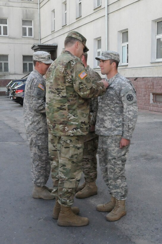 Sgt. Kenneth L. Reeck, with the 364th Expeditionary Sustainment Command, is awarded the Army Achievement Medal for his exceptionally meritorious service during Anakonda 2016 in Warsaw, Poland, June 6. Anakonda 2016 is one of U.S. Army Europe's premier multinational training events, which features 24 nations and seeks to train, exercise and integrate Polish national command and force structures into an allied, joint, multinational environment.