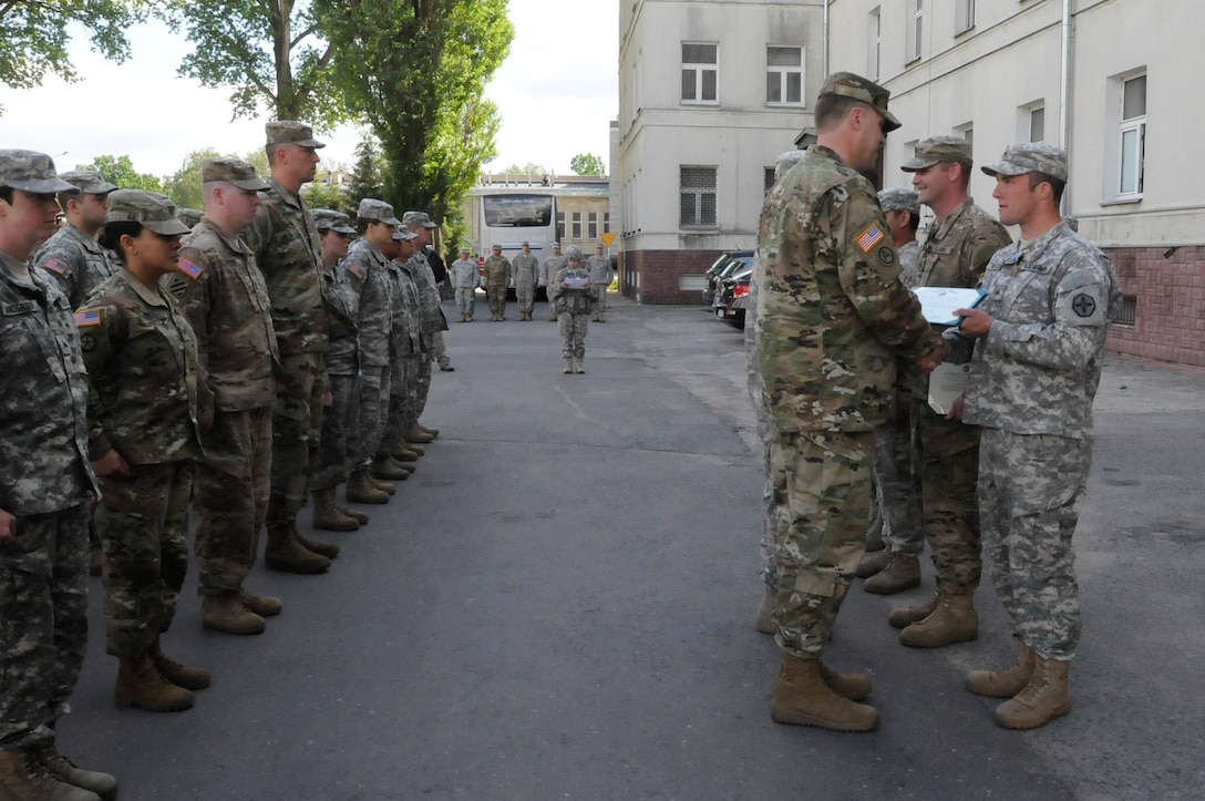 Sgt. Kenneth L. Reeck, with the 364th Expeditionary Sustainment Command, is awarded the Army Achievement Medal for his exceptionally meritorious service during Anakonda 2016 in Warsaw, Poland, June 6. Anakonda 2016 is one of U.S. Army Europe's premier multinational training events, which features 24 nations and seeks to train, exercise and integrate Polish national command and force structures into an allied, joint, multinational environment.