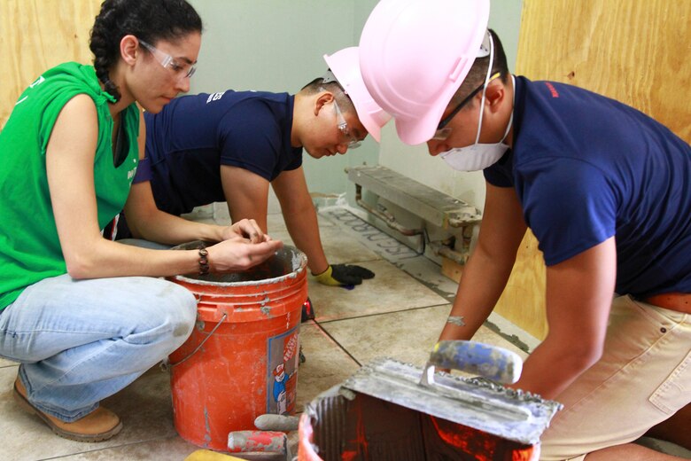 Marines and Poolees from Recruiting Station New York Marines and Poolees volunteer to assist Habitat for Humanity, a non-profit organization that builds and fixes homes for the less fortunate, in repairing a two-story home on Coney Island in Brooklyn, N.Y. on 28 May, 2016, that was damaged during Hurricane Sandy in 2013. (U.S. Marine Corps photo by Cpl. Brandon Thomas)