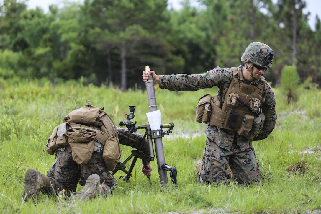The gunner of a mortar team with 1st Battalion, 2nd Marine Regiment, 2nd Marine Division, prepares to drop a round into the mortar barrel at Camp Lejeune, N.C., June 6, 2016. Marines underwent mortar familiarization and proficiency training in preparation for their upcoming deployment in support of Special-Purpose Marine Air-Ground Task Force. (U.S. Marine Corps photo by Lance Cpl. Aaron K. Fiala/Released)