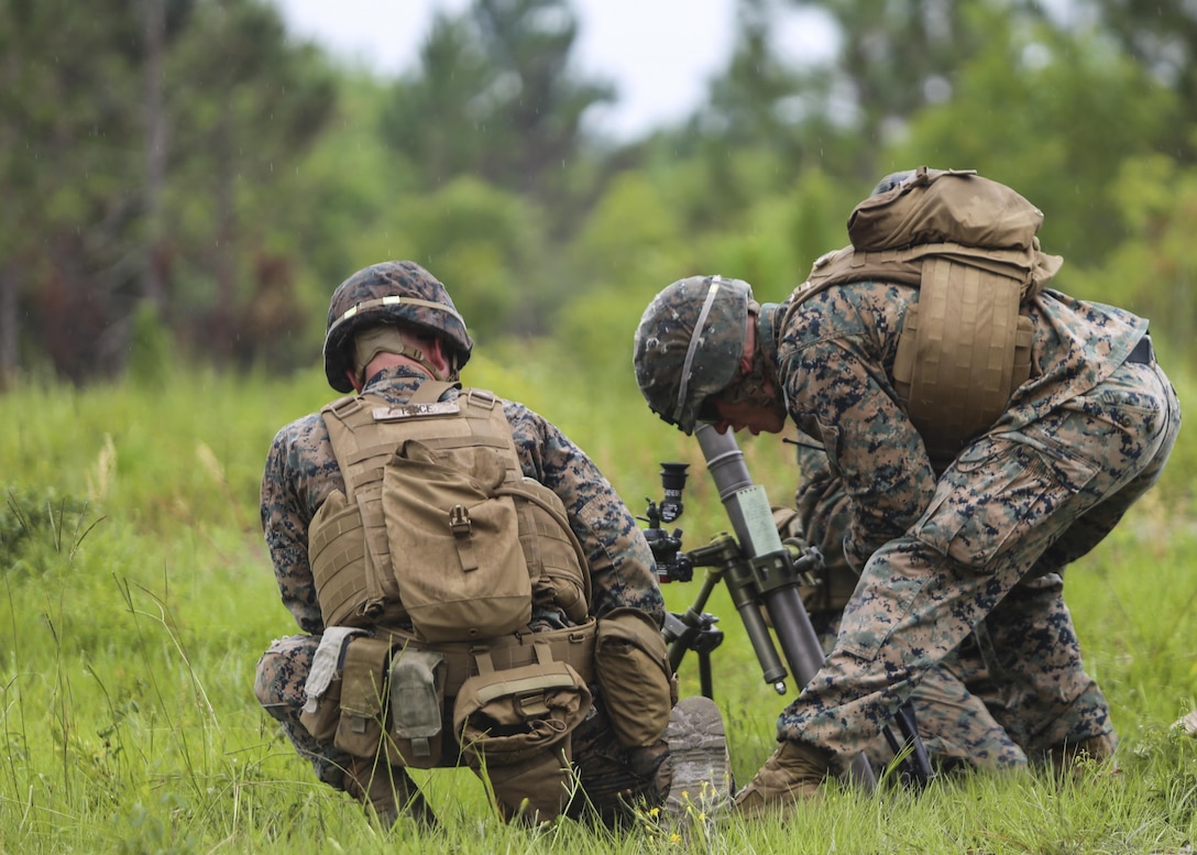 A section leader with 1st Battalion, 2nd Marine Regiment, verifies his mortar team has made the proper adjustments for the next course of fire during a training exercise at Camp Lejeune, N.C., June 6, 2016. Marines underwent mortar familiarization and proficiency training in preparation for their upcoming deployment in support of Special-Purpose Marine Air-Ground Task Force. (U.S. Marine Corps photo by Lance Cpl. Aaron K. Fiala/Released)