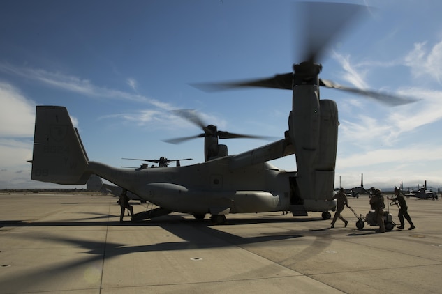 Marines with Marine Medium Tiltrotor Squadron (VMM) 165 inspect an MV-22B Osprey after a training flight aboard Marine Corps Air Station Miramar, Calif., June 8. The training consisted of confined area landings (CAL) and reduced visibility landings (RVL). (U.S. Marine Corps photo by Sgt. Michael Thorn/Released)