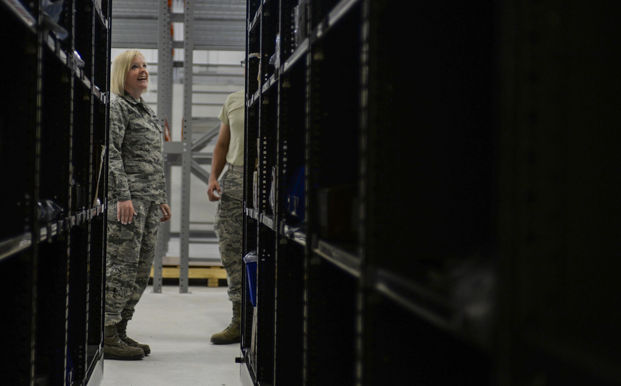 Tech. Sgt. Tiffany Larson, 99th LRS NCO in charge of F-35 aircraft parts store, surveys the shelves of the new location that the F-35 parts store will be working out of at Nellis Air Force Base, Nev., June 6, 2016. With the Air Force’s growing F-35 program, it is essential to supply the shops that support the airframe with the facilities necessary to perform at their highest potential. (U.S. Air Force photo by Airman 1st Class Kevin Tanenbaum)