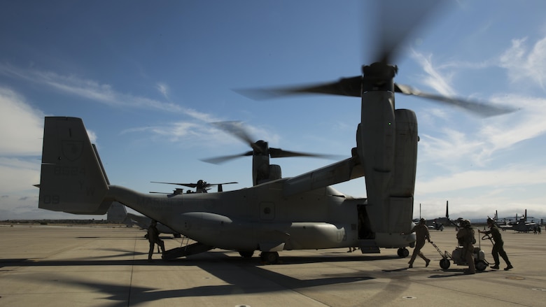 Marines with Marine Medium Tiltrotor Squadron 165 inspect an MV-22B Osprey after a training flight at Marine Corps Air Station Miramar, California, June 8. The training consisted of confined area landings and reduced visibility landings.
