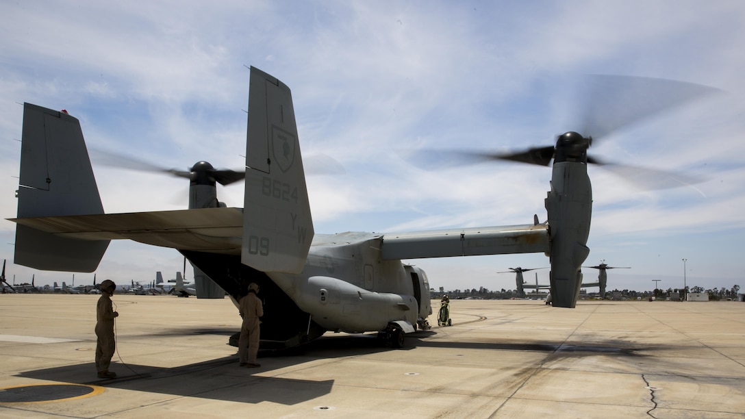 Marines with Marine Medium Tiltrotor Squadron 165 prepare an MV-22B Osprey for a training flight aboard Marine Corps Air Station Miramar, California, June 8. The training consisted of confined area landings and reduced visibility landings.