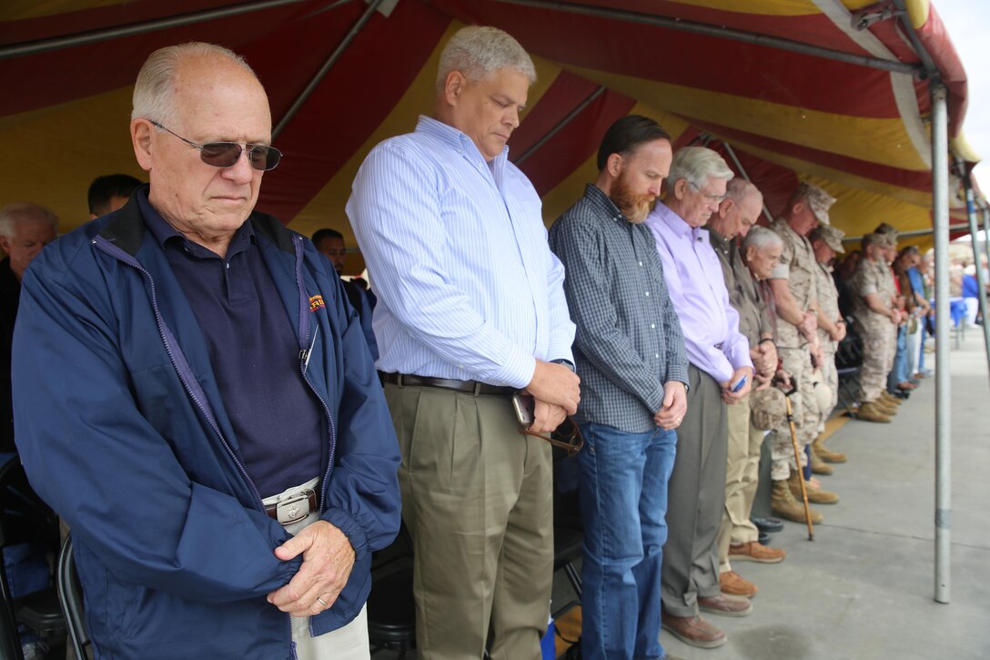 MARINE CORPS BASE CAMP PENDLETON, Calif. – Marines and veterans bow their heads during a rededication ceremony as part of the 1st Combat Engineer Battalion, 1st Marine Division, 75th anniversary at Camp Pendleton May 26, 2016. After touring the area, 1st CEB honored its current unit awards while also recognizing the veterans in attendance who served in some of the notorious battles of old, during World War II, the Vietnam War and the Gulf War.  (U.S. Marine Corps photo by Cpl. Demetrius Morgan/RELEASED)