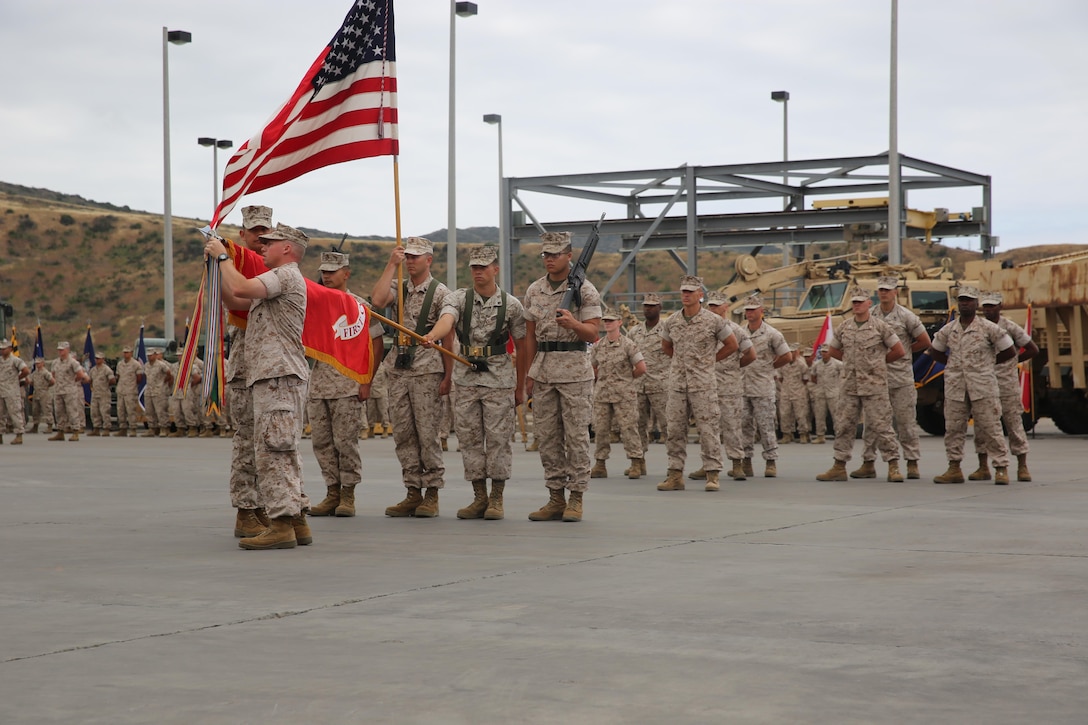 MARINE CORPS BASE CAMP PENDLETON, Calif. –  Lt. Col. Colin Smith, the commanding officer of 1st Combat Engineer Battalion, 1st Marine Division, pins the defense superior service medal to the unit colors during a rededication ceremony as part of the unit’s 75th anniversary at Camp Pendleton May 26, 2016. After touring the area, 1st CEB hosted a rededication ceremony, where Marines individually pinned each unit award onto the unit colors. (U.S. Marine Corps photo by Cpl. Demetrius Morgan/RELEASED)