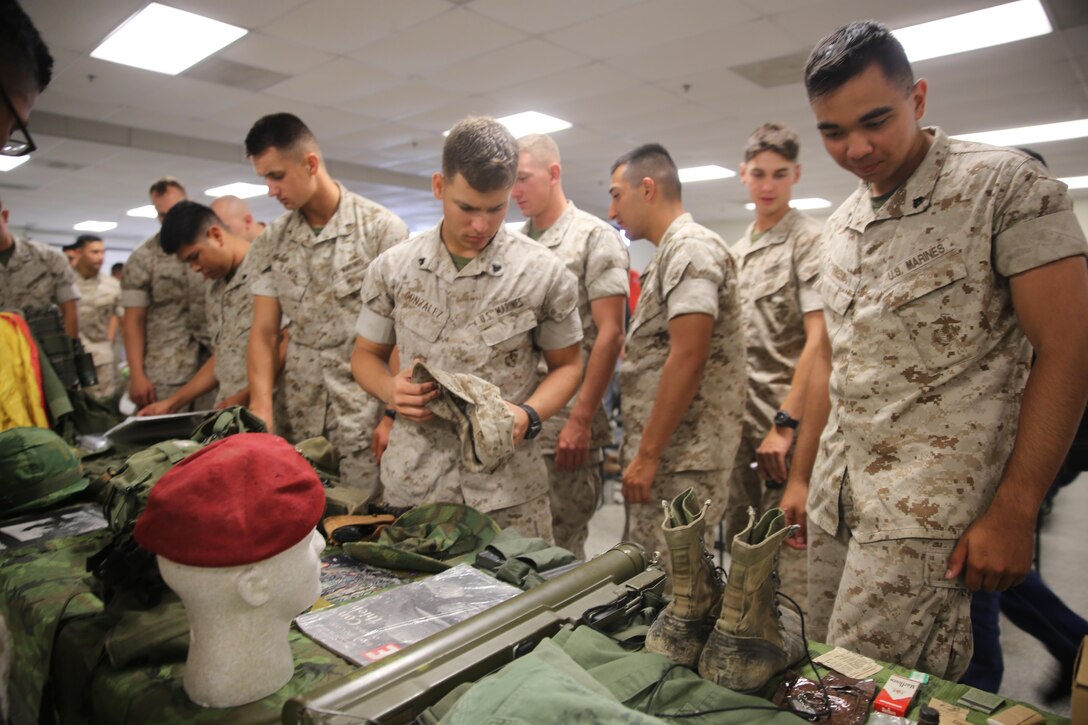 MARINE CORPS BASE CAMP PENDLETON, Calif. – Marines with 1st Combat Engineer Battalion, 1st Marine Division, looked at some of the tools used throughout the history of the Marine Corps during the unit’s 75th anniversary celebration at Camp Pendleton May 27, 2016. On the second day, veterans were center stage as they presented themselves and their military experiences with the current personnel of 1st CEB. (U.S. Marine Corps photo by Cpl. Demetrius Morgan/RELEASED)