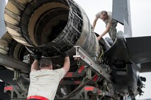 U.S. Air Force Tech. Sgt. Kevin Brown and Airman 1st Class Collin Blackburn, both aerospace propulsion technicians assigned to the 494th Aircraft Maintenance Unit out of Royal Air Force Lakenheath, England, guide an engine into place on an F-15E Strike Eagle dual-role fighter aircraft June 8, 2016, during RED FLAG-Alaska (RF-A) 16-2 at Eielson Air Force Base, Alaska. During RF-A, maintenance units work diligently to keep jets operational despite a high-operations tempo created by the simulated deployed environment, preparing U.S. and partner-nation forces for contingency operations. (U.S. Air Force photo by Capt. Elias Zani/Released)