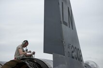 U.S. Air Force Airman 1st Class Collin Blackburn, an aerospace propulsion journeyman assigned to the 494th Aircraft Maintenance Unit out of Royal Air Force Lakenheath, England, uses a torque wrench to secure an engine into place on an F-15E Strike Eagle dual-role fighter aircraft June 8, 2016, during RED FLAG-Alaska (RF-A) 16-2 at Eielson Air Force Base, Alaska. Units from across the Department of Defense and partner nations send units to Eielson for RF-A to train for contingency operations in a controlled environment. (U.S. Air Force photo by Capt. Elias Zani/Released)