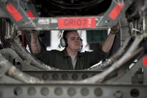 U.S. Air Force Senior Airman Christopher Strader, an aerospace propulsion journeyman assigned to the 494th Aircraft Maintenance Unit out of Royal Air Force Lakenheath, England, removes an engine guide cart from behind an F-15E Strike Eagle dual-role fighter aircraft so his team can better maneuver to secure an engine June 8, 2016, during RED FLAG-Alaska (RF-A) 16-2 at Eielson Air Force Base, Alaska. RF-A provides an opportunity for Airmen to work together alongside partner-nation forces to solve issues and keep jets operational while serving on a simulated deployment. (U.S. Air Force photo by Capt. Elias Zani/Released)