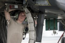 U.S. Air Force Airman 1st Class Collin Blackburn, an aerospace propulsion journeyman assigned to the 494th Aircraft Maintenance Unit out of Royal Air Force Lakenheath, England, secures an engine into place on an F-15E Strike Eagle dual-role fighter aircraft June 8, 2016, during RED FLAG-Alaska (RF-A) 16-2 at Eielson Air Force Base, Alaska. RF-A is a Pacific Air Forces commander-directed field training exercise for U.S. and allied forces, providing joint offensive counter-air, interdiction, close air support, and large force employment training in a simulated combat environment. (U.S. Air Force photo by Capt. Elias Zani/Released)