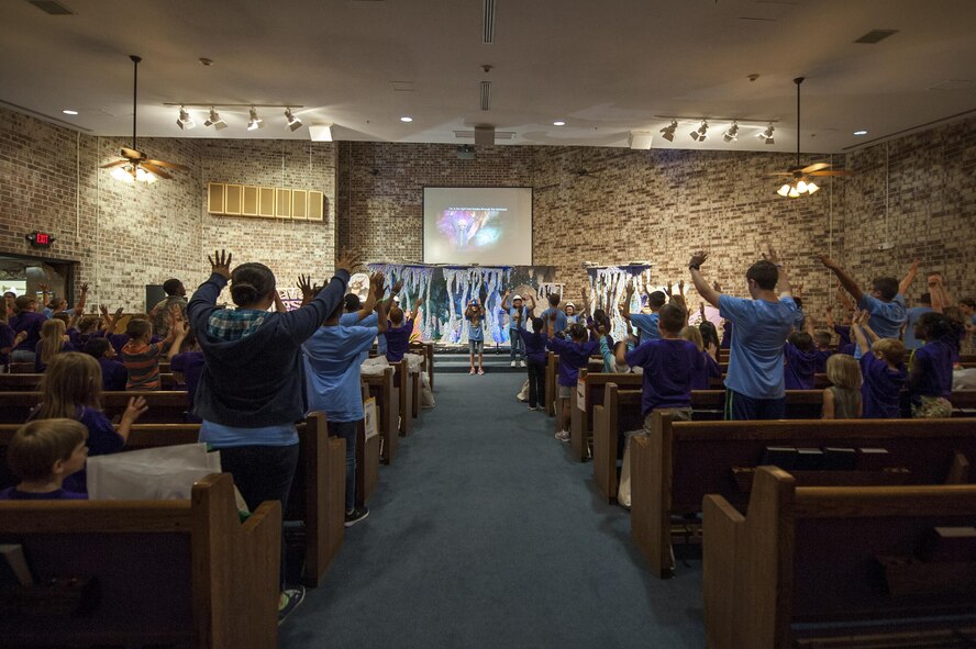 Participants sing and dance during Vacation Bible School, June 7, 2016, at Moody Air Force Base, Ga. Vacation Bible School is a week-long event for Moody children between the ages of three and 12. (U.S. Air Force photo by Airman 1st Class Lauren M. Hunter/Released)