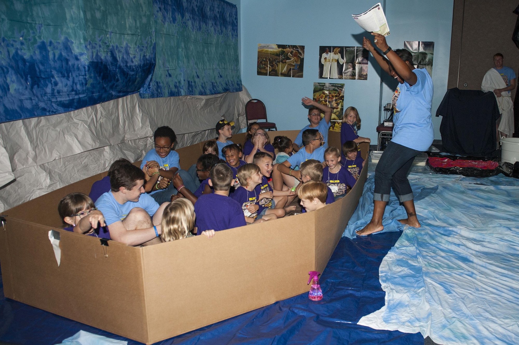 U.S. Air Force Master Sgt. Yolanda Wallace, 23d Wing chaplain assistant, and Moody children act out a biblical story during Vacation Bible School, June 7, 2016, at Moody Air Force Base, Ga. During the week, children learned Bible stories, Bible verses and life lessons in an interactive environment. (U.S. Air Force photo by Airman 1st Class Lauren M. Hunter/Released)