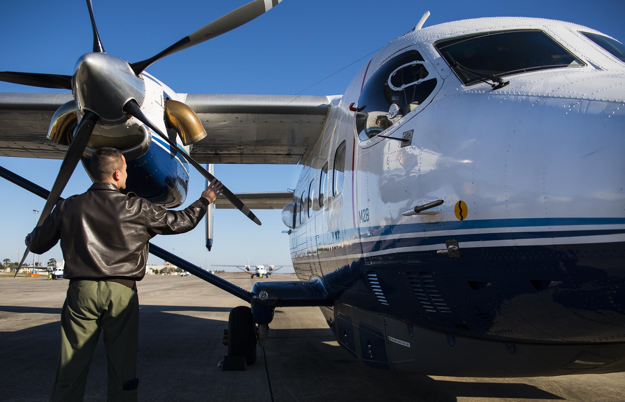A loadmaster performs preflight checks on a C-145 Skytruck prior to an airdrop mission at Duke Field, Fla.  The Skytrucks are primarily used for new aircrew qualifications and flight proficiency missions.  (U.S. Air Force photo/Tech. Sgt. Sam King)   