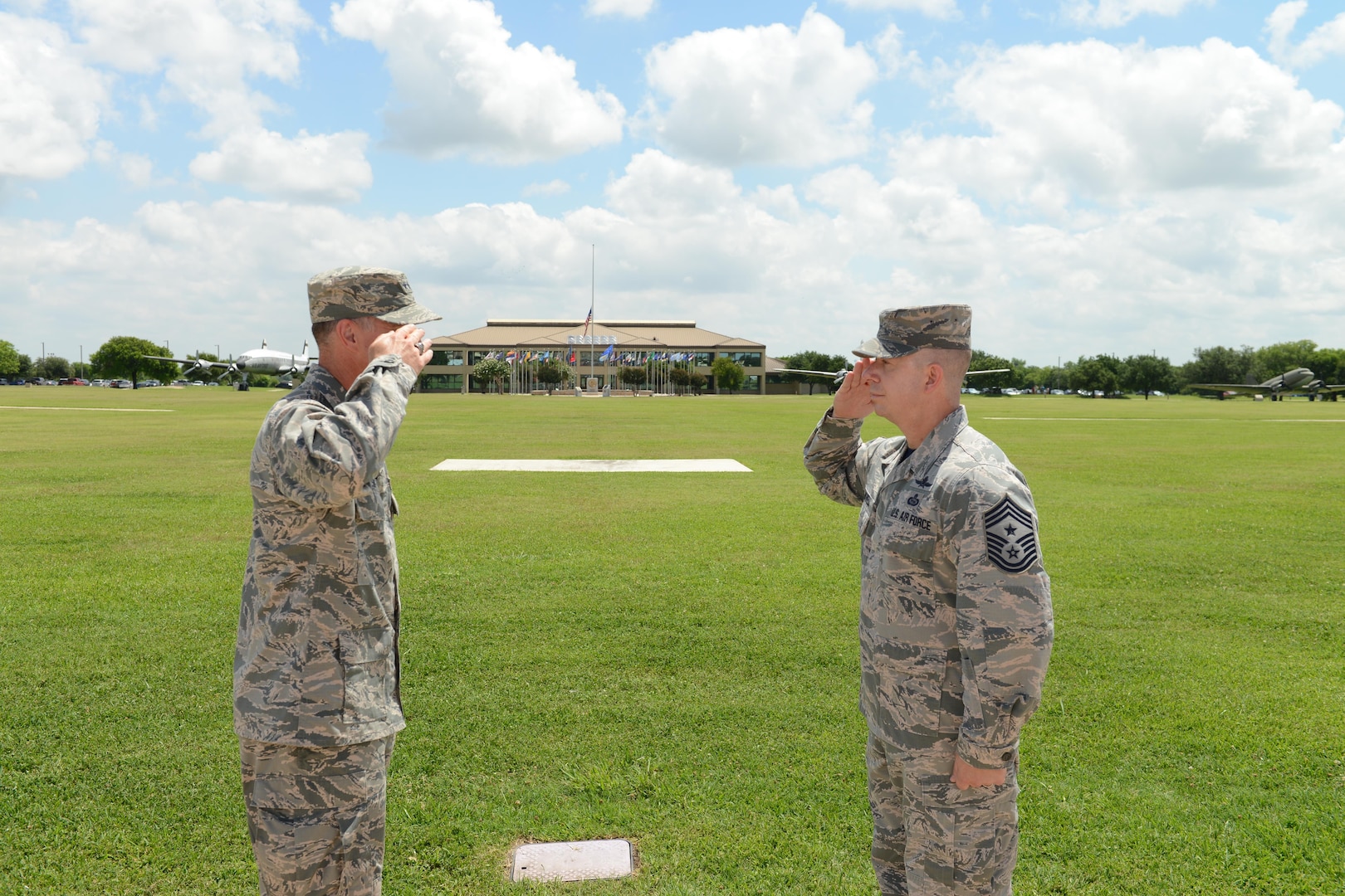 "Chief Master Sgt. Brendan Criswell, Command Chief, 24th Air Force, salutes Maj. Gen. Ed Wilson, Commander, 24th Air Force, during the chief's final reenlistment swear-in at JBSA-Lackland 10 June. Criswell, after 27 years on active duty, is scheduled to transfer in July to serve as command chief for Air Force Space Command in Colorado Springs, Colo." (US Air Force photo by MSgt Stuart Wilson)
