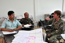 U.S. Navy Cmdr. Tammy Servies discusses a patient treatment scenario with Dr. Kim Seng Chawn and Dr. (Col.) Mak Sophai during a subject matter expert exchange focused on humanitarian assistance and disaster response June 9, 2016 in Kampot Province, Cambodia. The exchange was part of Pacific Angel 16, a U.S. Air Force led humanitarian assistance and civil military operation mission that builds partner capacity through medical and health outreach, engineering civic projects and subject matter exchanges. Participants included medical professionals from the U.S. Air Force, U.S. Navy, Australian Defense Forces, Royal Cambodian Armed Forces and Kampot Provincial Hospital and Health Center. Servies is a U.S. Navy Preventive Medicine Physician deployed from Navy Environmental and Preventive Medicine Unit 6 as part of Pacific Angel 16-2. (U.S. Air Force photo by Capt. Susan Harrington)