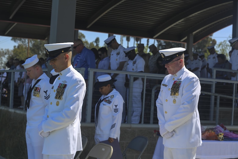 MARINE CORPS BASE CAMP PENDLETON, Calif. - Master Chief Petty Officer Frank Dominguez, left, and Master Chief Petty Officer Michael Smith, bow their head for the invocation during the change of charge and retirement ceremony for Smith on Camp Pendleton June 3, 2016. Smith is retiring after 30 years of honorable service in the United States Navy. Dominguez, a Superior, Arizona native, is replacing Smith, a Ridgecrest native, as the command master chief of I Marine Expeditionary Force. (U.S. Marine Corps Photo By Cpl. Garrett White/Released)