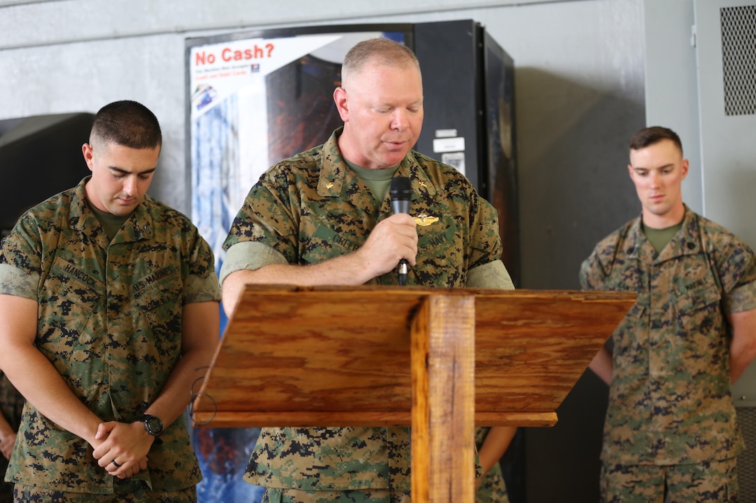 Lt. Cmdr. Paul Greer gives the invocation during a change of command ceremony at Marine Corps Air Station Cherry Point, N.C., June 6, 2016. Greer was recogized for the 2016 Military Chaplains Association Distinguished Service Award, and will recieve the award in Oct. 2016. The award recognizes one representative from each branch of service for their performance and dedication to the troops while serving as a chaplain. Greer is the chaplain for Marine Aircraft Control Group 28, and is the second 2nd MAW chaplain to win the award for the Marine Corps in the past two years. (U.S. Marine Corps photo by Lance Cpl. Mackenzie Gibson/Released) 